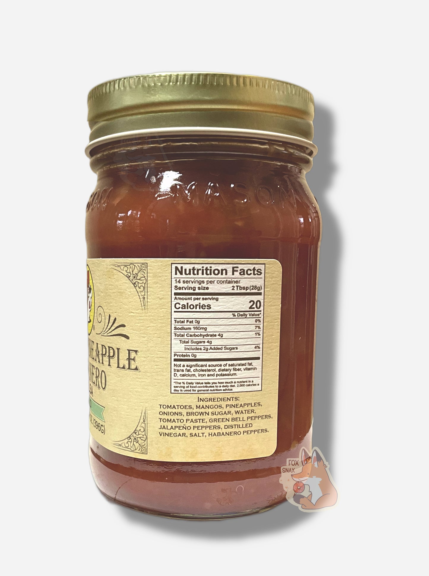 A picture of the right side of a glass jar of Buc-ee's Mango Pineapple Habanero -  the label is a "old-timey" sort of white/yellow with flared edges.  The middle reads Ingredients: Tomatoes, Mangoes, Pineapples, Onions, Brown Sugar, Water, Tomato Paste, Green Bell Peppers, Jalapeno Peppers, Distilled Vinegar, Salt, Habanero Peppers.