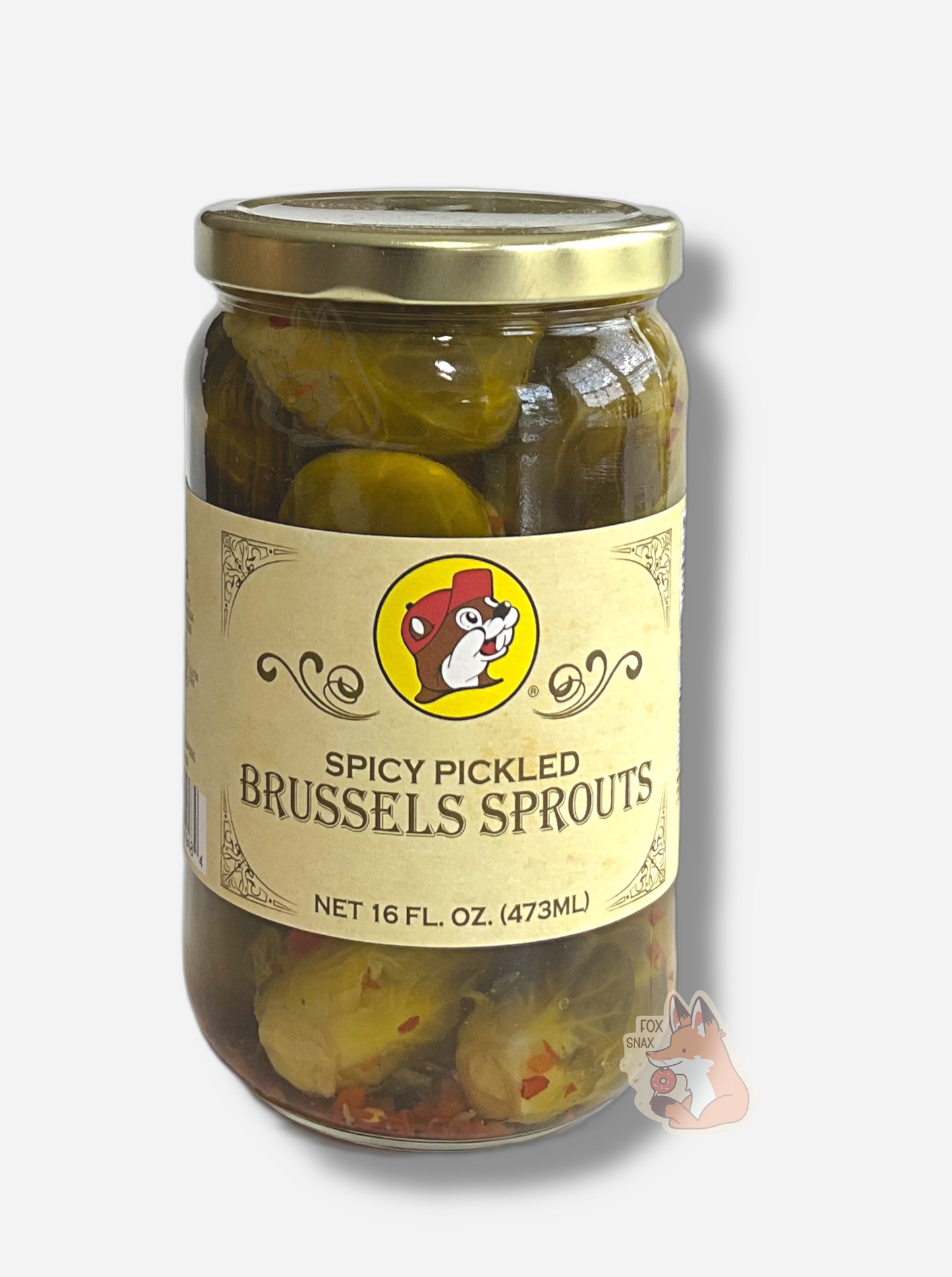 A picture of the front of a glass jar of Buc-ee's Spicy Pickled Brussels Sprouts - the label is a "old-timey" sort of white/yellow with flared edges.  The middle has a giant Buc-ee the Beaver logo on it.  In the jar, floating sprouts in a green brine can be seen, dotted with red pepper flakes throughout.