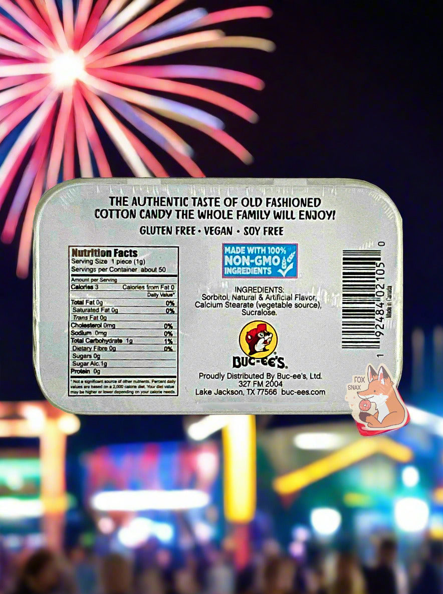 A picture of a back of a tin of Buc-ees Cotton Candy Mints.  The back cover is decorated with a small picture of Buc-ee The Beaver, and has the following text: The Authentic Taste Of Old Fashioned Cotton Candy The Whole Family Will Enjoy!, Gluten Free, Vegan, Soy Free.  The background shows beautiful red and blue fireworks, set against the background of a county fair at night.