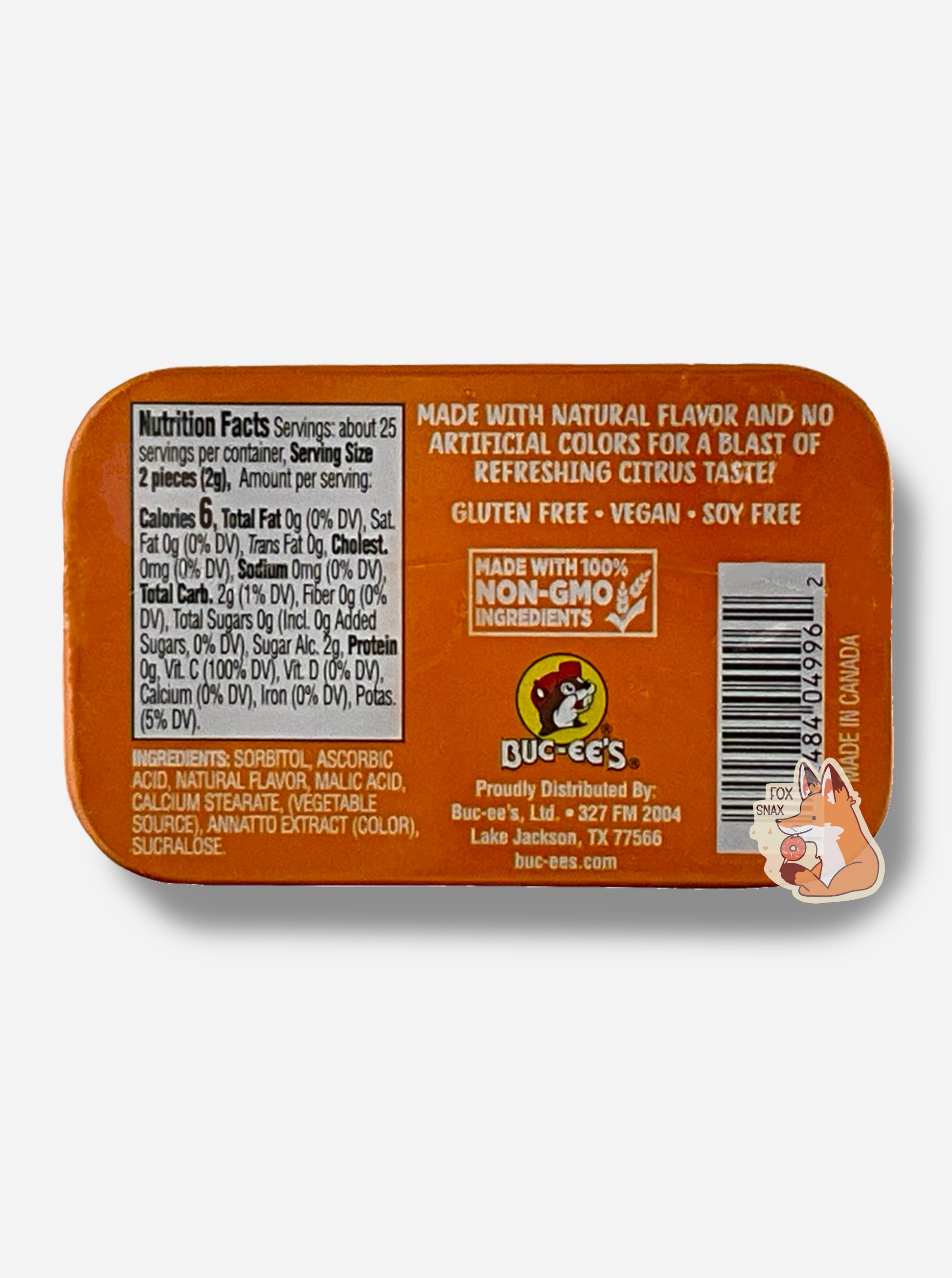 A picture of a back of a tin of Buc-ees Orange Blast Sours.  The back cover is decorated with a small picture of Buc-ee The Beaver, and has the following text: Made With Natural Flavor And No Artificial Colors For A Blast Of Refreshing Citrus Taste!, Gluten Free, Vegan, Soy Free, made with 100% Non-GMO Ingredients.