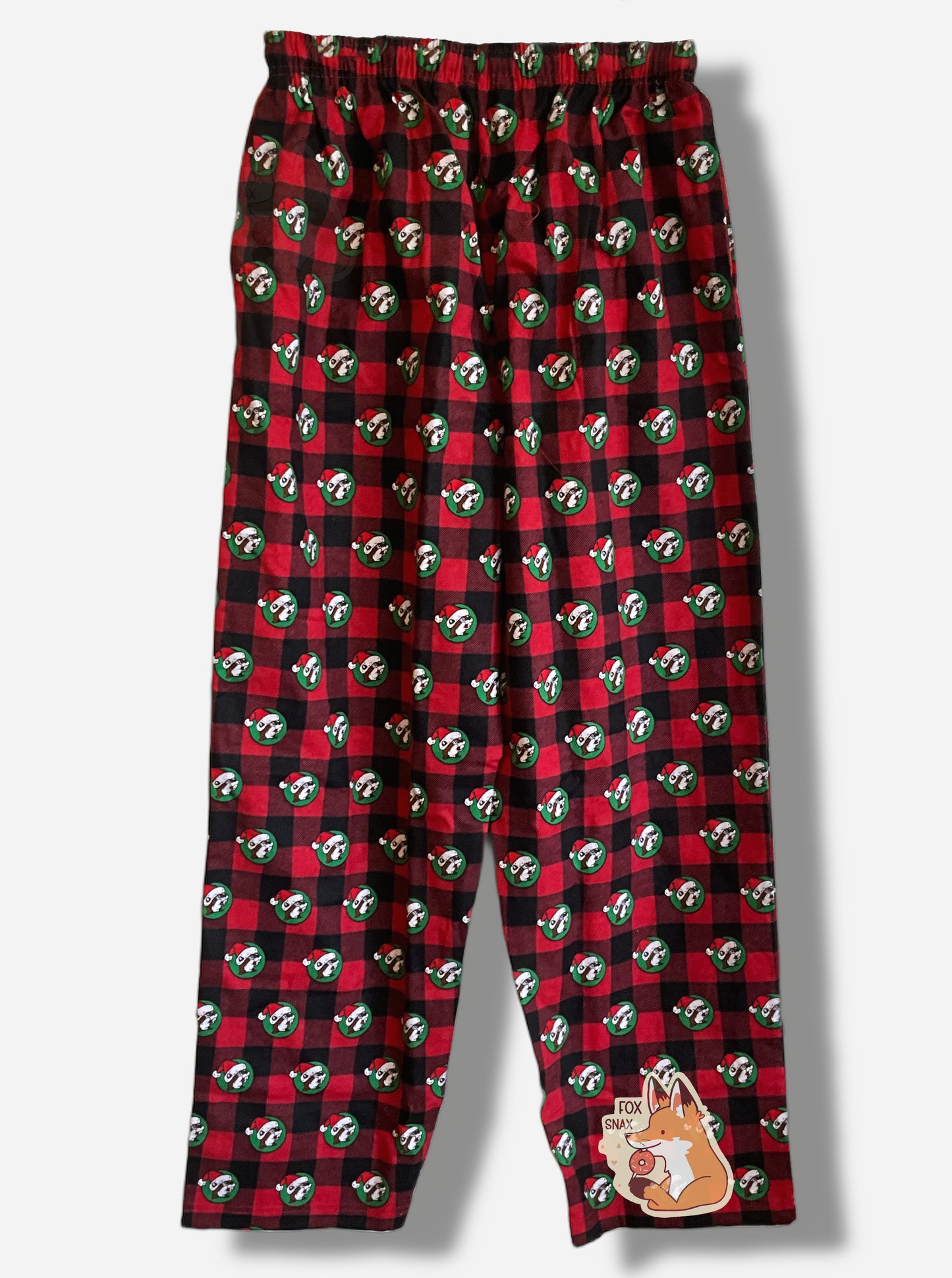 A picture the back of a pair of a black and red plaid pajama pants.  The pants are studded with the Buc-ee's logo - a brown furred beaver with a significant overbite - who is wearing a Santa cap against a green circular background.  