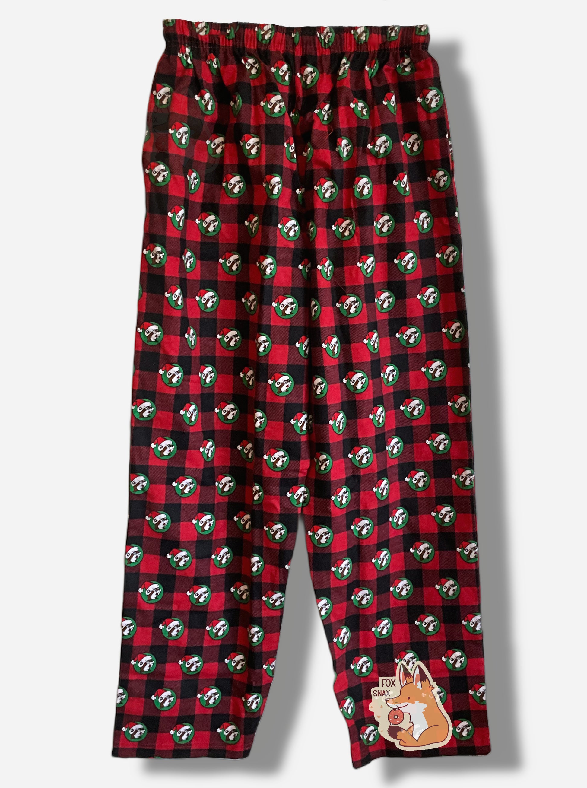 A picture the back of a pair of a black and red plaid pajama pants.  The pants are studded with the Buc-ee's logo - a brown furred beaver with a significant overbite - who is wearing a Santa cap against a green circular background.  