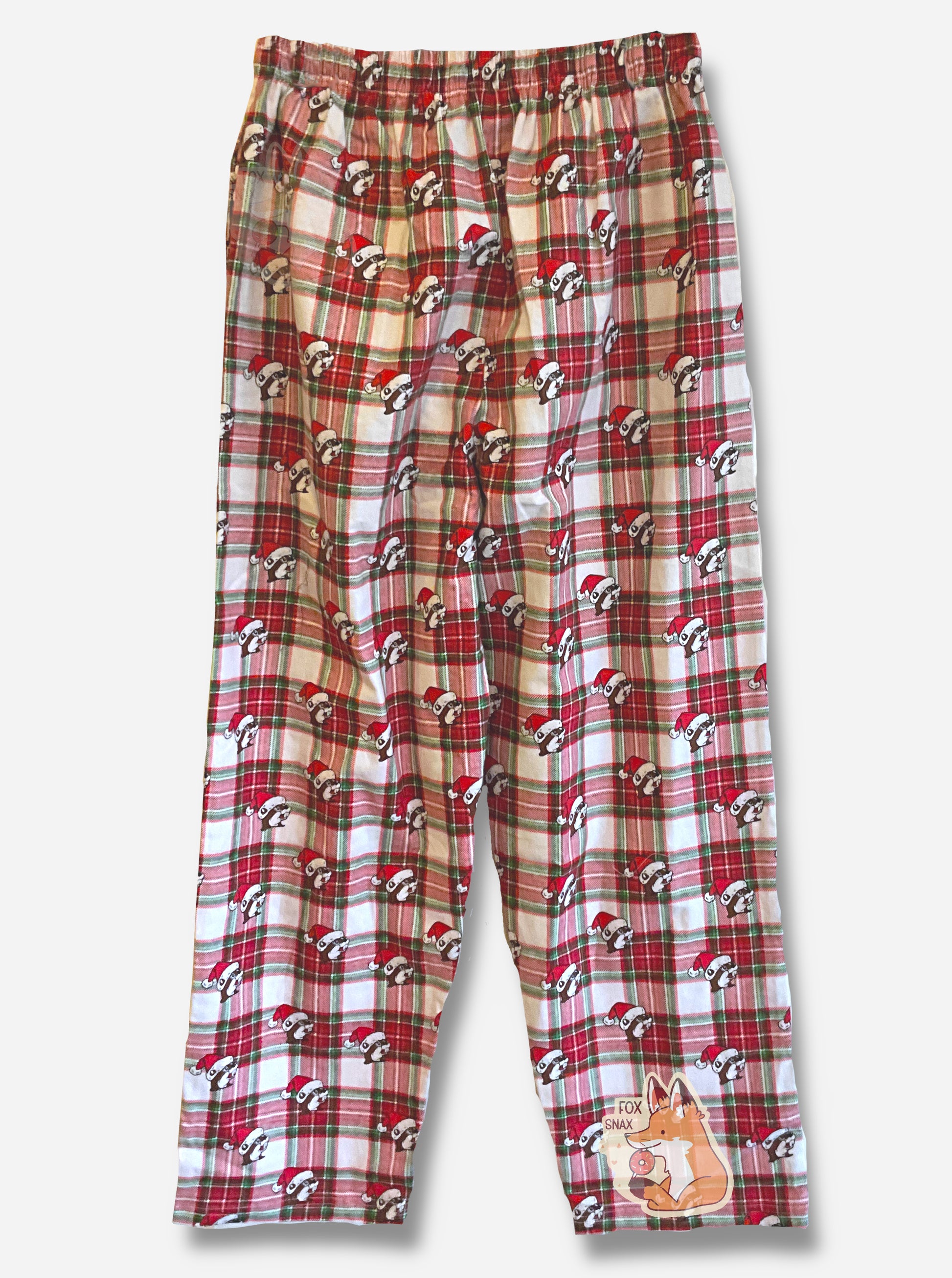 A picture of the back of a plaid pair of Buc-ee's pajama pants.  The pattern is red, white, and green, and is dotted with Buc-ee the Beaver heads.  Each of the heads is wearing a red Santa hat.  