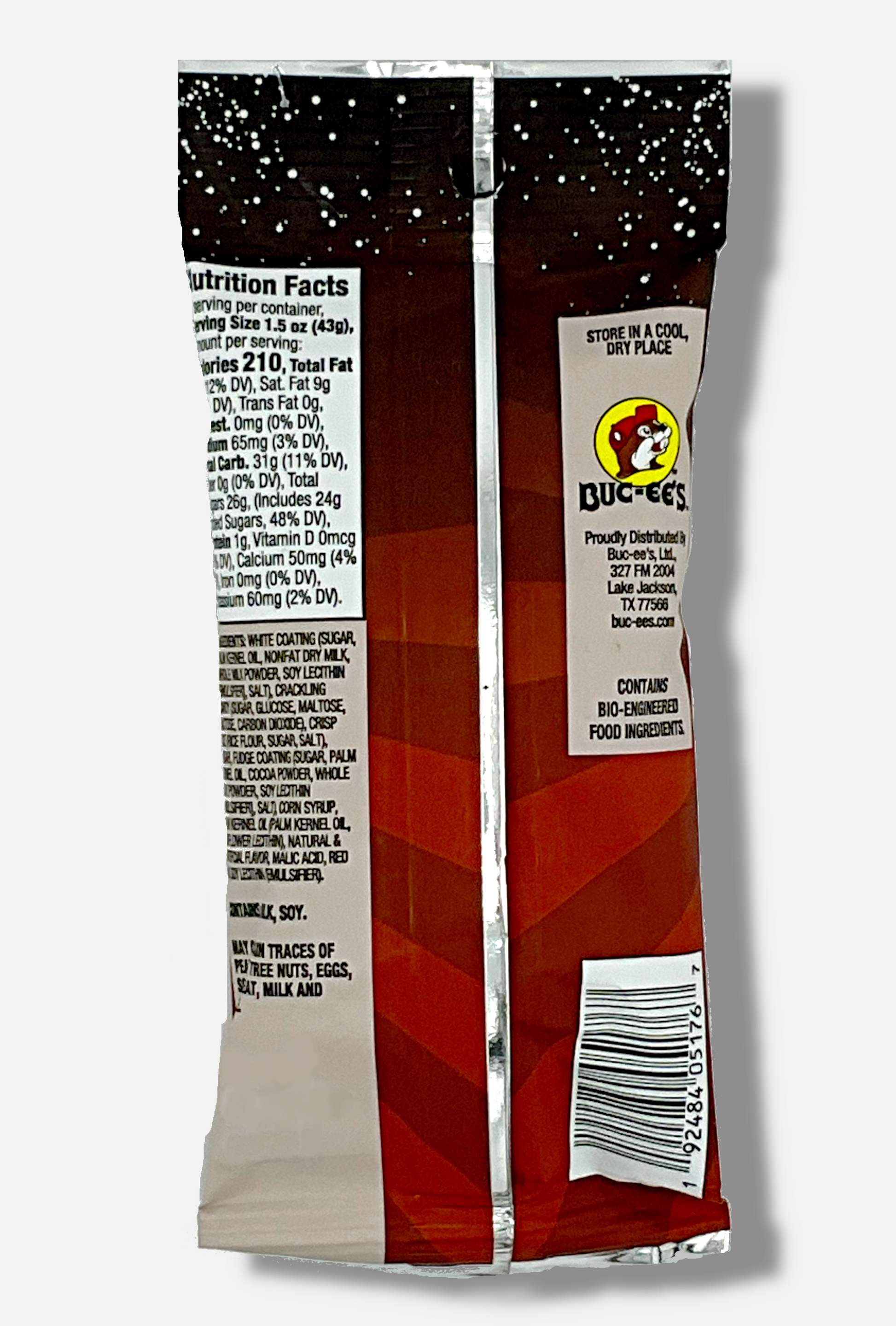 A picture of the back of a bag of Buc-ee's Cosmic Pops, in Cherry Cola flavor.  The back of the bag reads STORE IN A COOL, DRY PLACE, then shows a picture of the Buc-ee's beaver logo, then CONTAINS BIO-ENGINEERED FOOD INGREDIENTS.