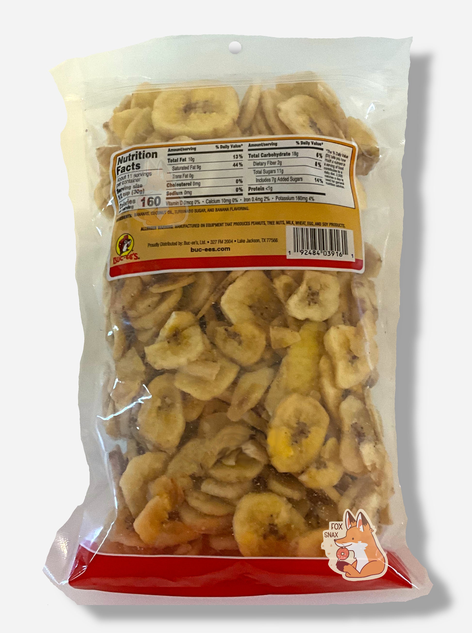 The back of a clear bag of Buc-ee's Sweetened Dried Banana Chips.  The bottom of the bag has a red stripe.  The middle of the bag is clear, and has a large amount of skinny circular yellow dried banana chips.