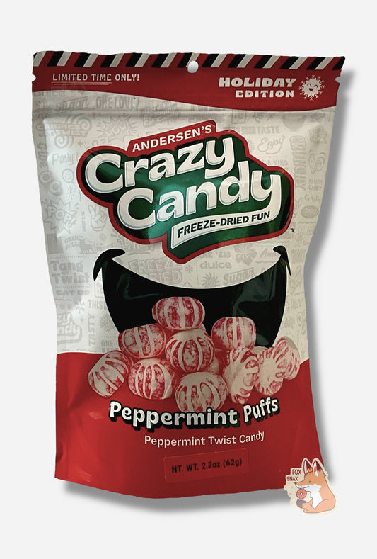 A large bag of Andersen's Peppermint Puffs.  The front of the bag also says Peppermint Twist Candy, Net Weight 2.2 oz.  It's Fun, Happy, Candy.  The top and bottom of the bag are red and the background is a large black against a white background.  The top of the bag reads LIMITED TIME ONLY and HOLIDAY EDITION next to a jolly snowflake.