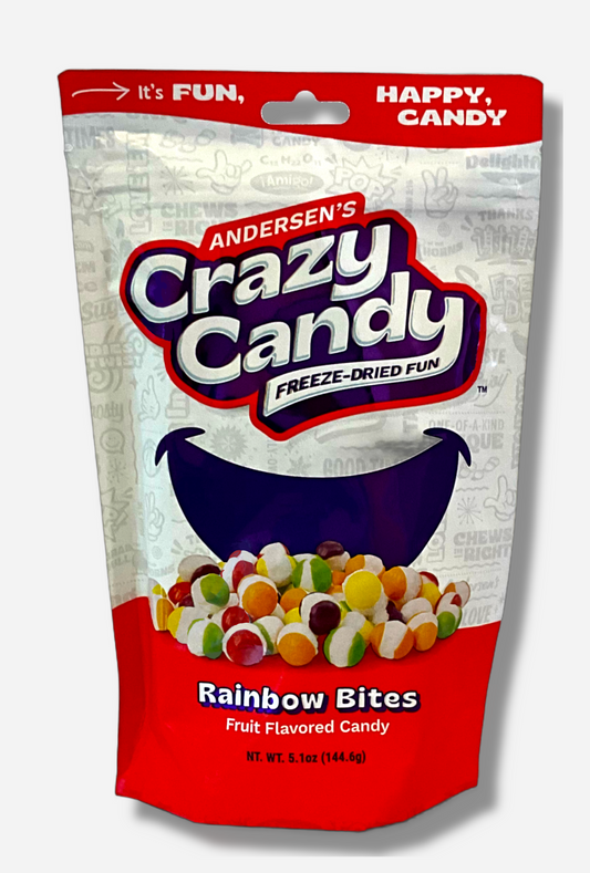 A large bag of Andersen's Crazy Candy Rainbow Bites.  The front of the bag also says Freeze-Dried Fun and Fruit Flavored Candy, Net Weight 5.1 oz.  It's Fun, Happy, Candy.  The top and bottom of the bag are red, and the background is a large purple smile against a white background.