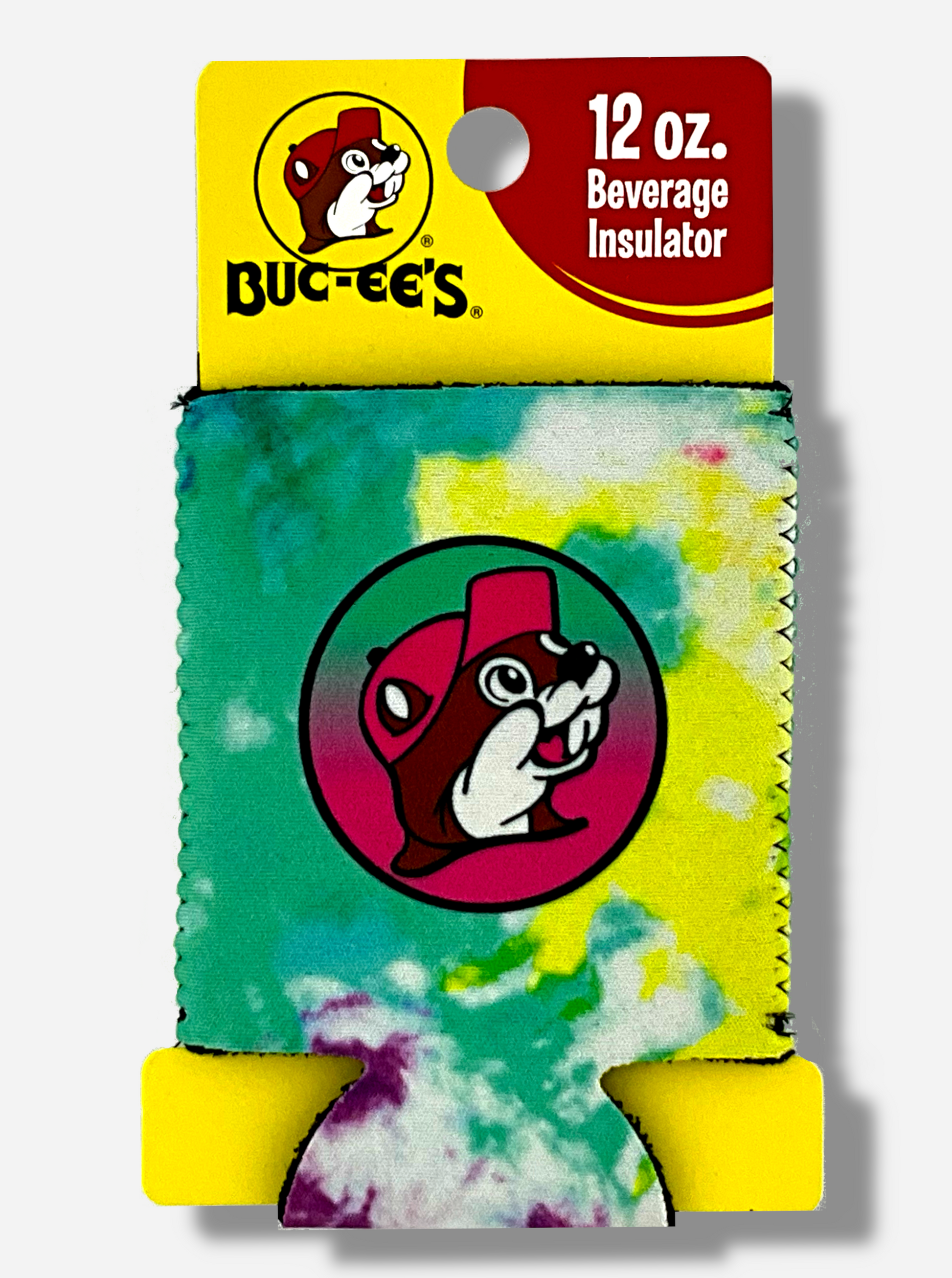 A picture of a foam and cloth tie-dyed Beverage Insulator, wrapped around a yellow piece of cardboard.  The cardboard reads BUC-EE's 12 oz. Beverage Insulator.  The front of the tie-dyed insulator has a picture of Buc-ee The Beaver on it, sillhoutted against a circle with a black outline.  The background in the circle starts at green and changes into a gradient at red at the bottom.  The primary colors of the tie dye are green, dark green, yellow, white,  and purple.