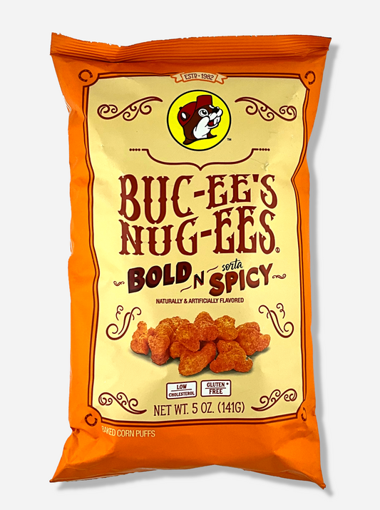 A picture of the front of a opaque, orange and yellow bag of Buc-ee's Nug-ee's Bold N Sorta Spicy, which are puffed corn snack with spicy flavors, and has a picture of Buc-ee the Beaver on it.  The bag reads: Naturally & Artificially Flavored.  Low Cholesterol.  Gluten Free.  Baked Corn Puffs.