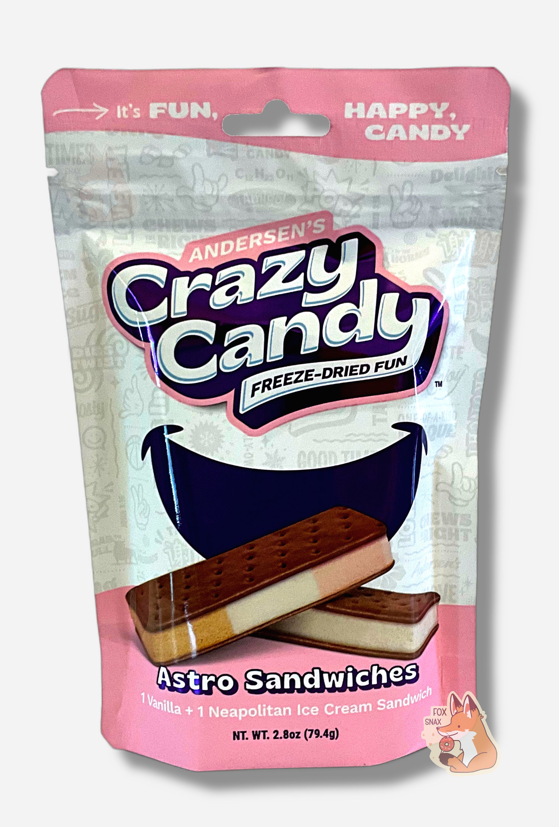 A large bag of Andersen's Astro Sandwiches.  The front of the bag also says Astro Sandwiches, 1 Vanilla + 1 Neapolitan Ice Cream Sandwich, Net Weight 2.8 oz.  It's Fun, Happy, Candy.  The top and bottom of the bag are pink, and the background is a large purple smile against a white background.