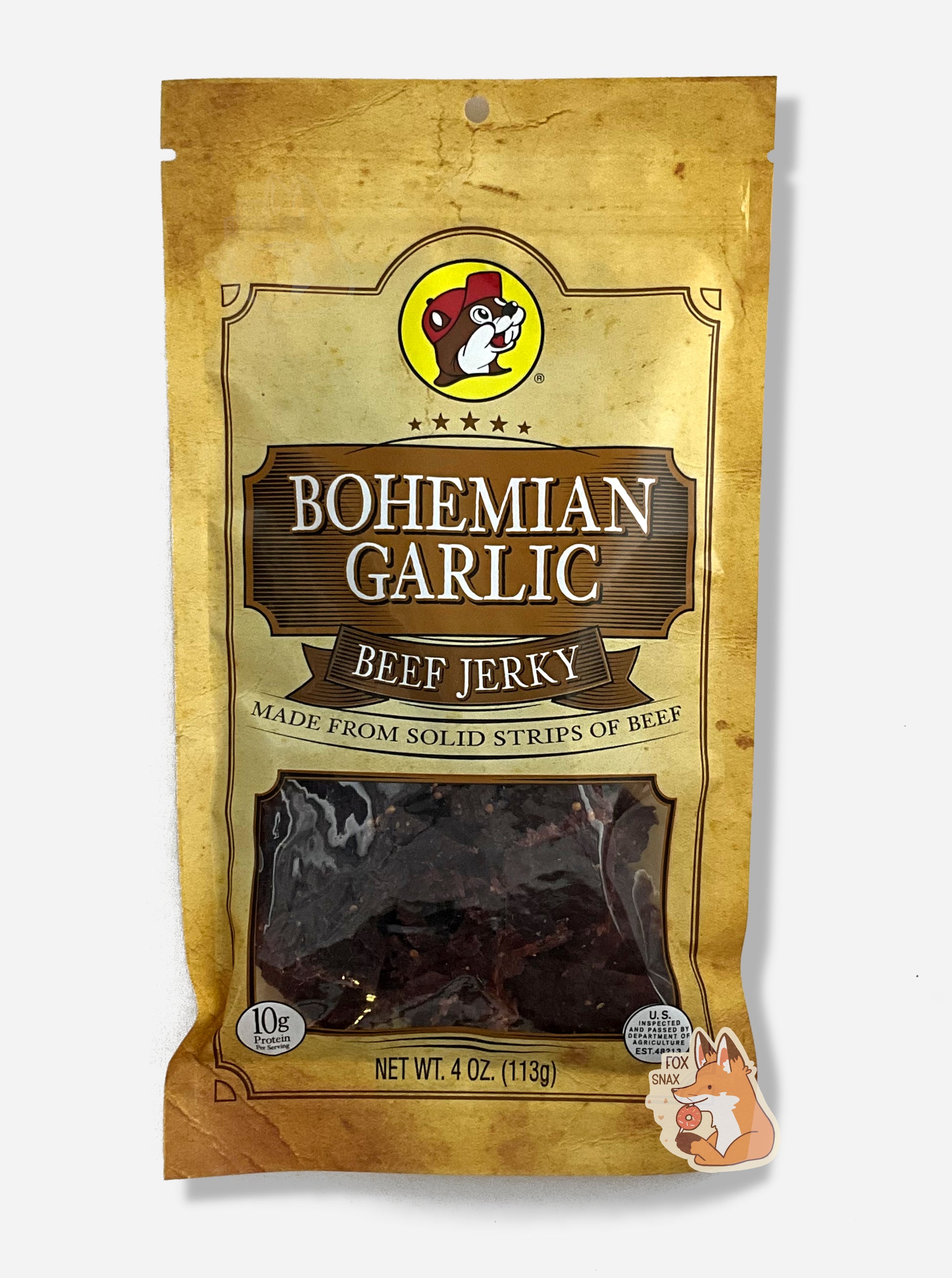 A picture of the front of a tan plastic bag of Buc-ee's Bohemian Garlic Beef Jerky.  The logo is in brown with white text.The label underneath reads 'Made From Solid Strips Of Beef'.A small window on the bottom of the bag shows the dark brown/red dried jerky inside.  The bag has a picture of Buc-ee the Beaver on it.