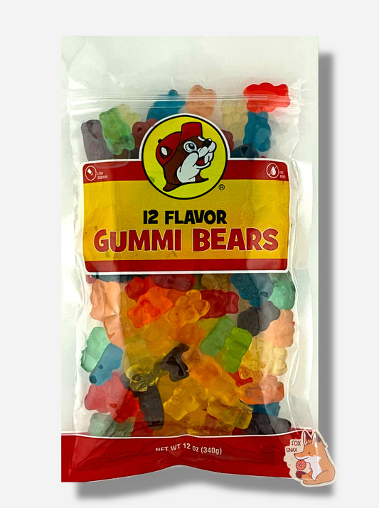 A picture of the front of a resealable bag of Buc-ee's 12 Flavor Gummi Bears, which are brightly colored gummi bears in twelve different flavors.  The bag reads 12 FLAVOR GUMMI BEARS, Low Sodium, Fat Free, and has a picture of Buc-ee the Beaver on it. The bears inside are bear-shaped, and are multiple shades of red, orange, yellow, green, blue, and purple.