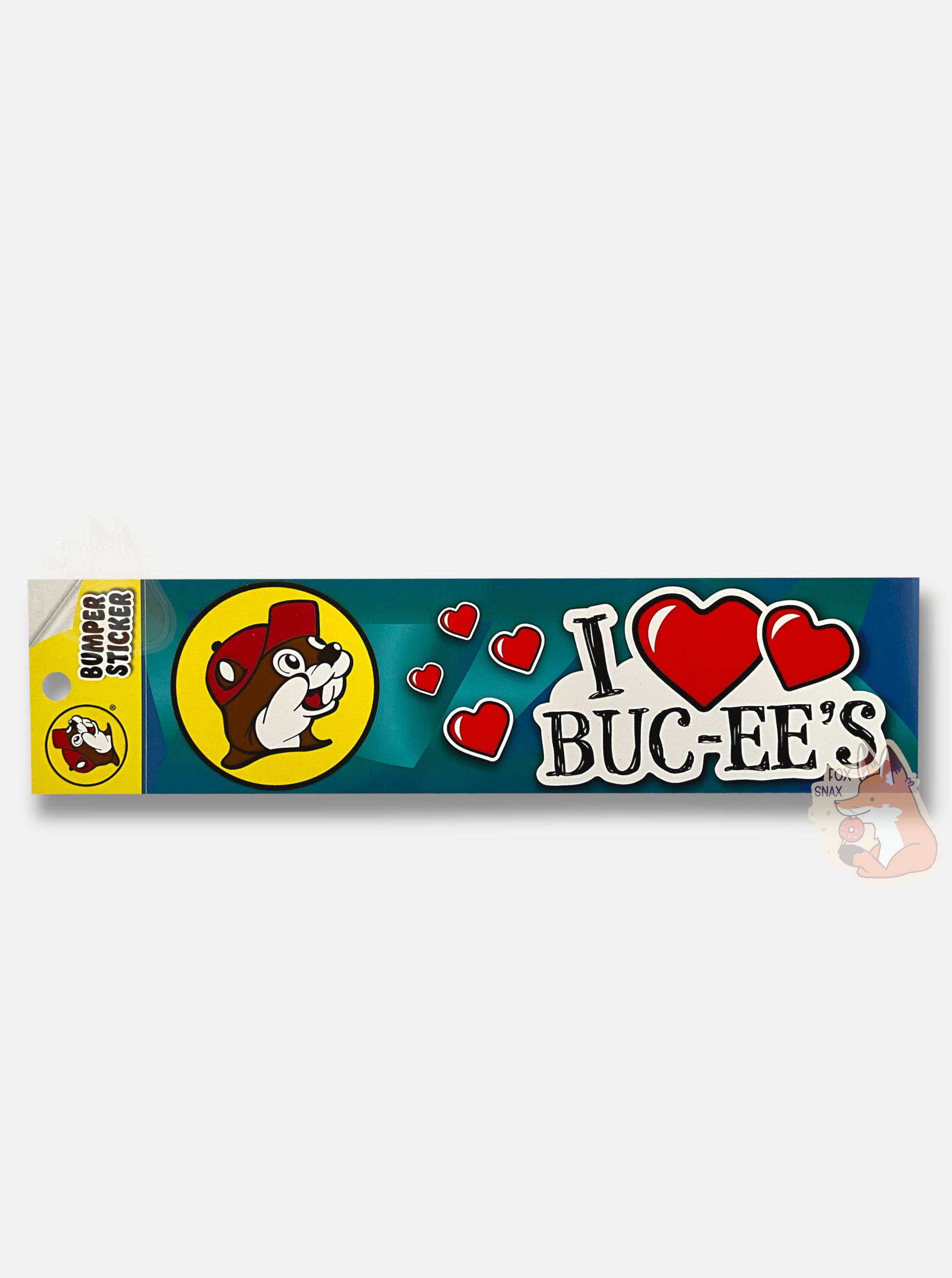 A picture of a colorful bumper sticker.  The left side is the iconic beaver icon, Buc-ee, surrounded by a yellow circle, wearing a red ball cap.  The middle is a series of red hearts.  The right side reads: I <heart> BUC-EE'S, with the heart in the middle being a pair of large red hearts.  The text is black with a white background, and is surrounded by angular blue shapes.