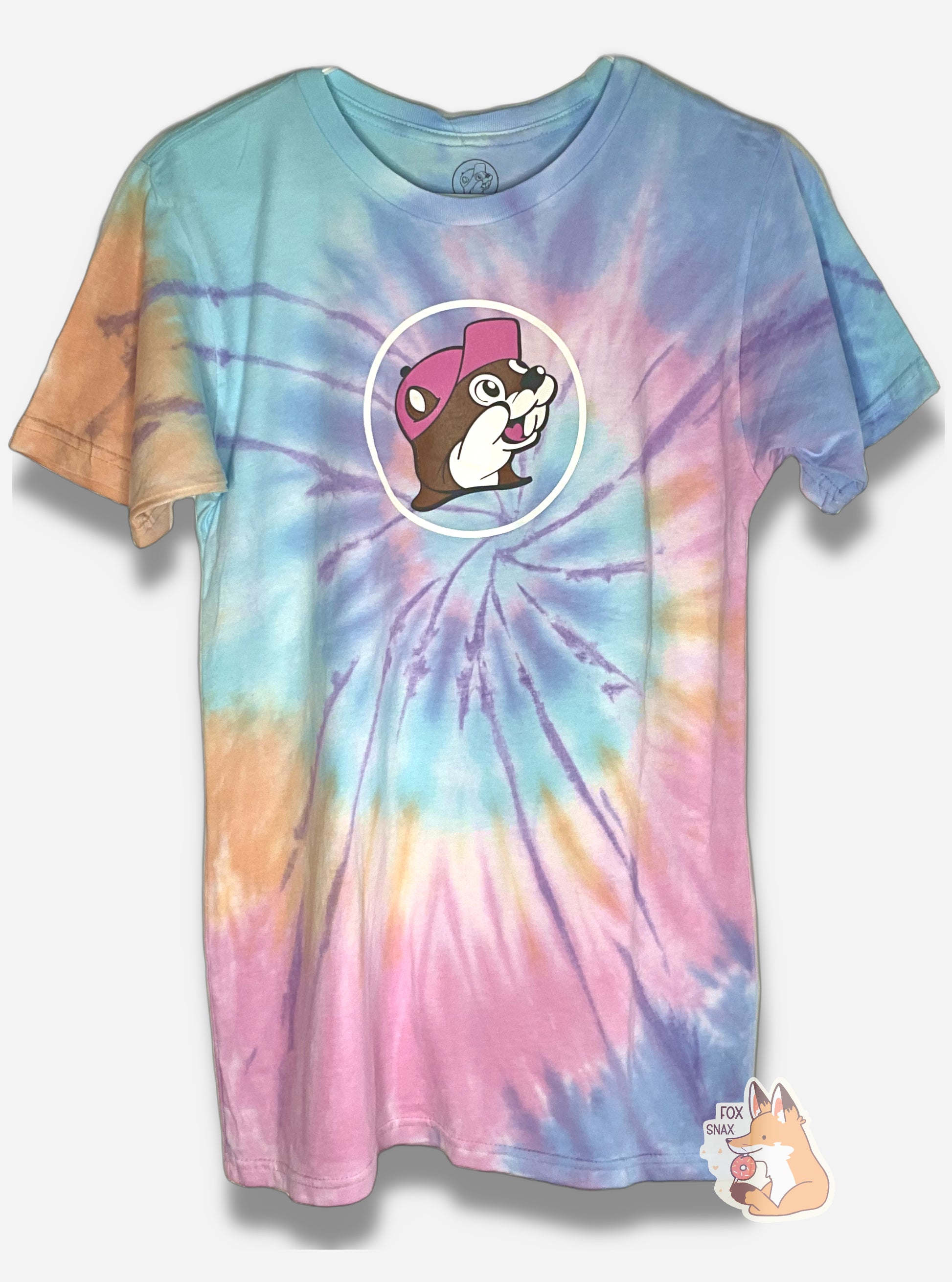 A picture of the front of a multicolor tie-dye t-shirt.  The shirt has a spiral of color; orange, blue, light blue,yellow, pink.  In the middle of the chest are is picture of Buc-ee the Beaver wearing a dark pink ballcap.