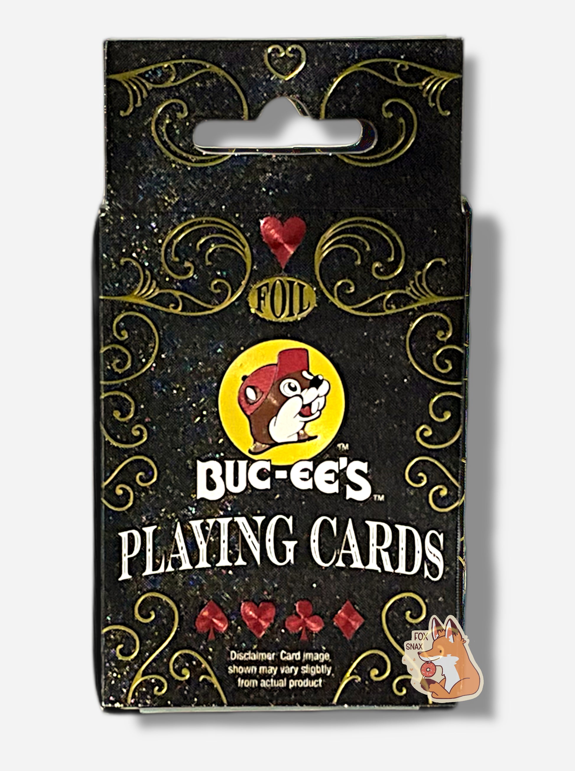 A picture of the back of pack of Buc-ee's Foil Playing Cards.  The pack is paper, black, with gold sparkles. The center reads FOIL in gold foil, then the Buc-ee's logo, then BUC-EE'S PLAYING CARDS.  A disclaimer is shown at the bottom, and reads Card image shown may vary slightly from actual product.