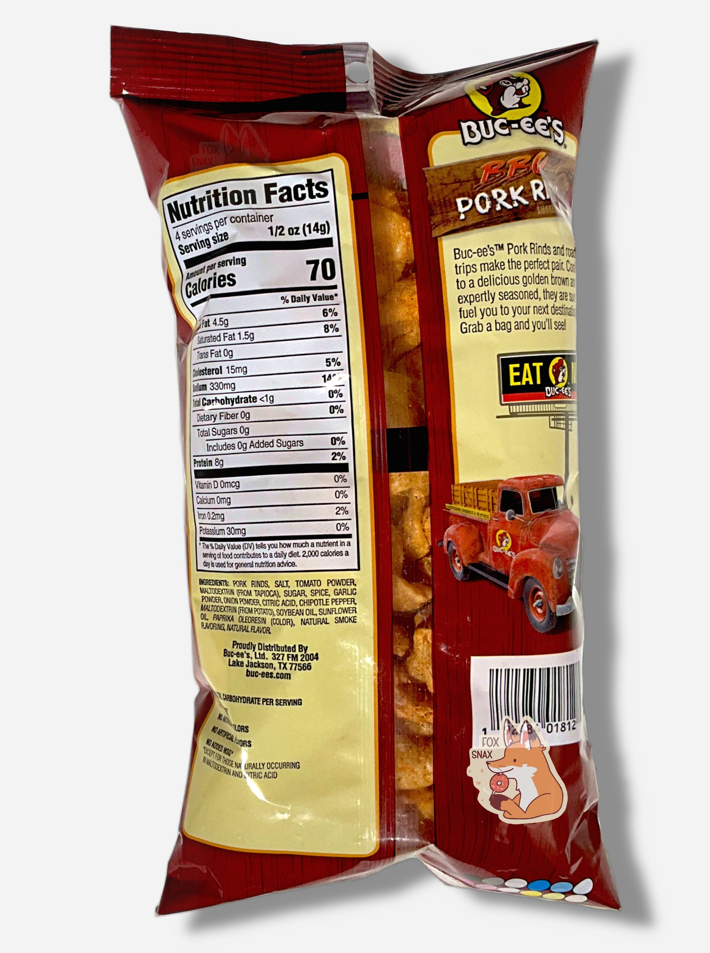 The back of a package of Buc-ee's BBQ  Flavored Pork Rinds. The package is a clear and red plastic, roughly rectangular package, and reads "Buc-ee's Pork Rinds and road trips make the perfect pair. Cooked to a delicious golden brown and expertly seasoned, they are sure to fuel you to your next destination. Grab a bag and you'll see!"  A picture of a Buc-ee's billboard reading EAT NOW above a old-school red pickup truck is on the lower right.  On the left of the package are nutrition facts, then ingredients.