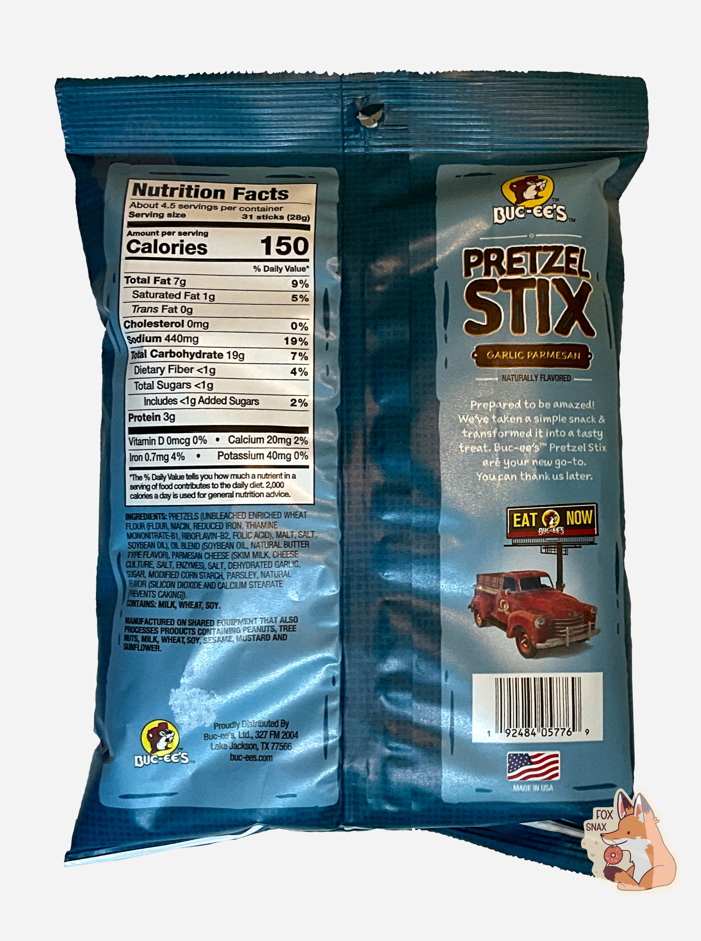 A picture of the back of a blue bag of Buc-ee's Pretzel Stix, Garlic Parmesan flavor.  The bag reads BUC-EE'S PRETZEL STIX, GARLIC PARMESAN, NATURALLY FLAVORED, then in a small white font, "Prepared to be amazed! We've taken a simple snack & transformed it into a tasty treat. Buc-ee's Pretzel Stix are your new go-to. You can thank us later."