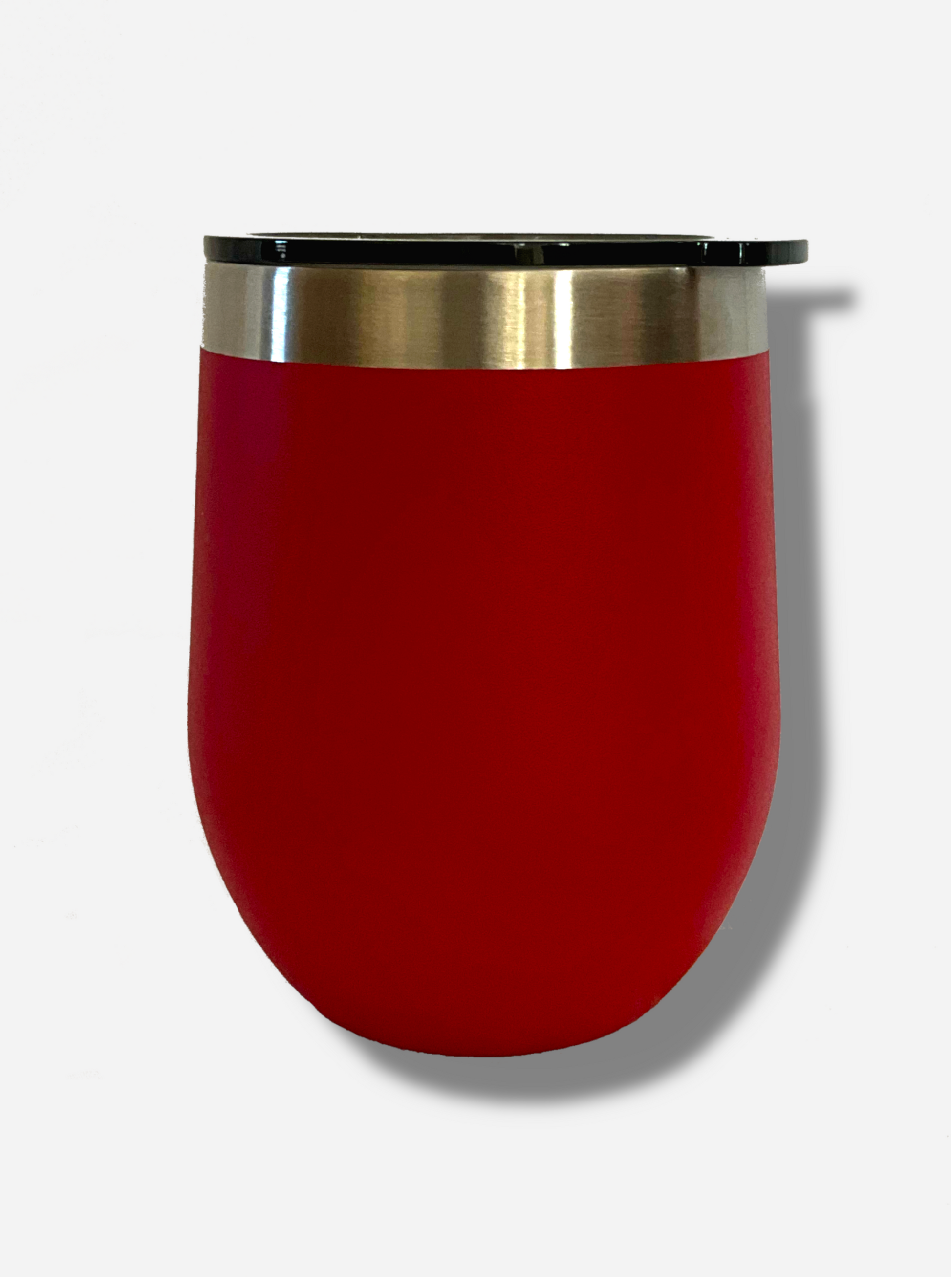 A picture of the back of a short red, sorta squatty, rounded tumber.  Its surface is smooth and red, as it is red paint covering stainless steel.  The top is plastic, and has a slider that fits three positions - fully open, partially closed, and closed.  The top of the tumbler is lined with a stainless steel band.