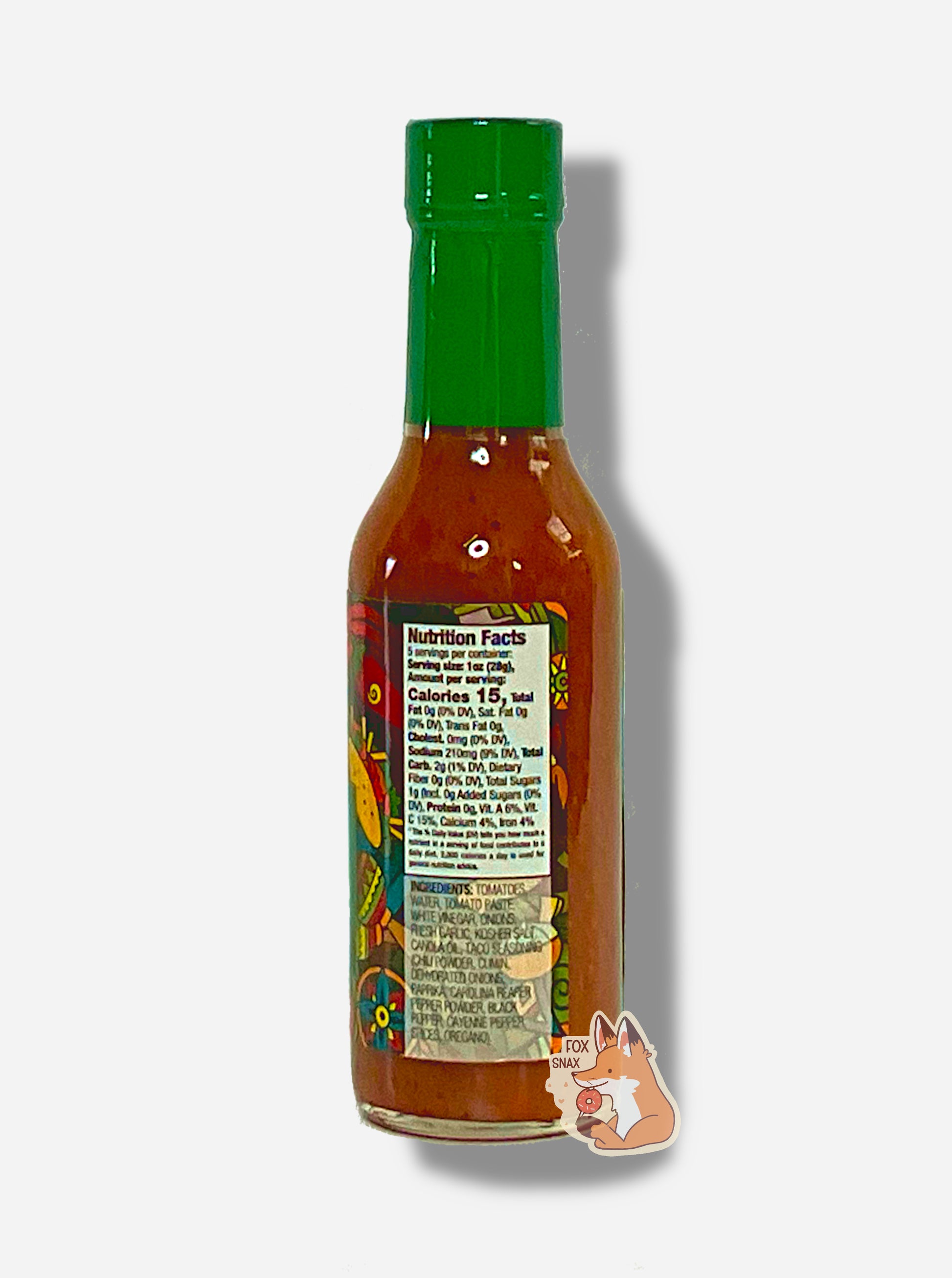 A picture of a small, tall glass bottle of hot sauce. The top of the bottle is sealed with a plastic top. The sauce inside is a yellow/tan color, with pepper seeds visible.